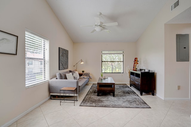 living room featuring electric panel, ceiling fan, light tile patterned flooring, and vaulted ceiling