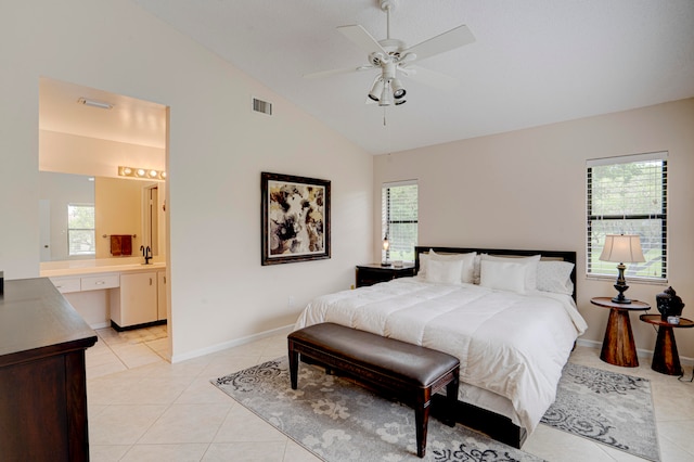 bedroom with multiple windows, vaulted ceiling, ceiling fan, and light tile patterned flooring