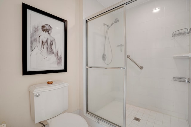 bathroom with toilet and an enclosed shower