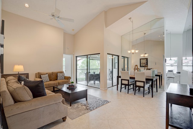 living room featuring ceiling fan, high vaulted ceiling, and light tile patterned floors