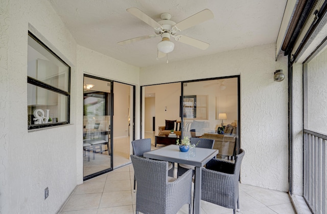 interior space with ceiling fan