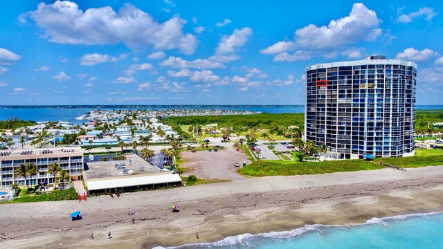 exterior space featuring a beach view and a water view