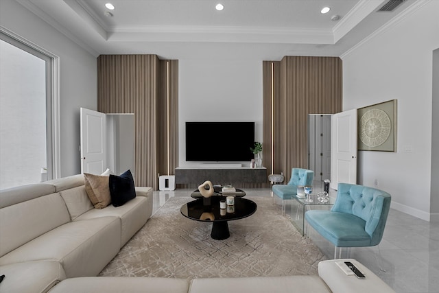 living room featuring crown molding and a tray ceiling