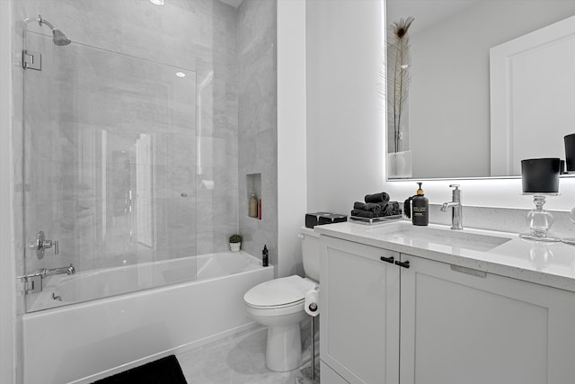 full bathroom featuring vanity, toilet, and tiled shower / bath