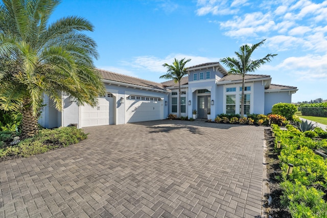 mediterranean / spanish-style home featuring a garage