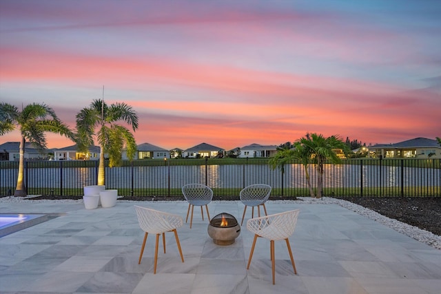 view of patio terrace at dusk