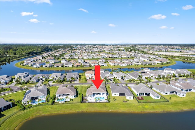 birds eye view of property with a water view