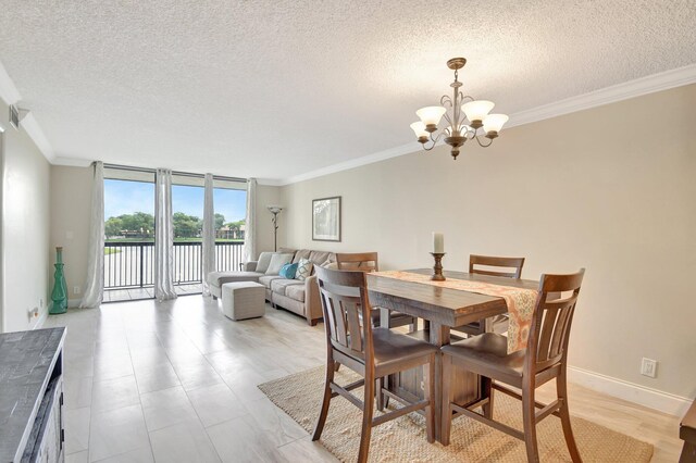 dining space with crown molding, a notable chandelier, and a textured ceiling