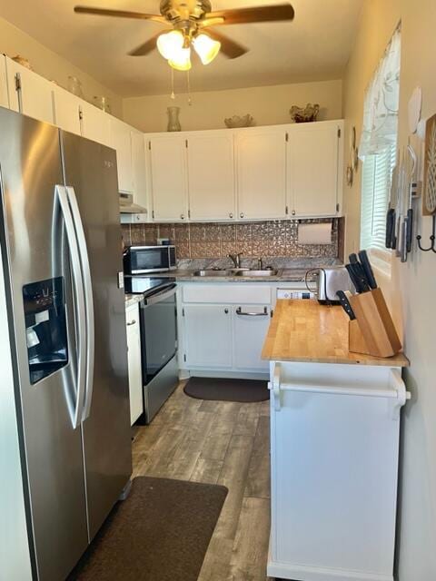 kitchen with white cabinetry, appliances with stainless steel finishes, and sink