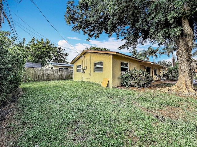 view of home's exterior with a lawn