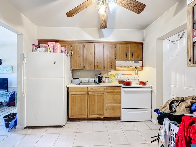 kitchen featuring light tile patterned flooring, ceiling fan, sink, and white appliances