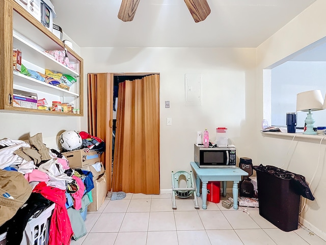 game room featuring ceiling fan and light tile patterned flooring