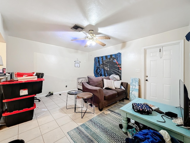 living room with ceiling fan and light tile patterned flooring