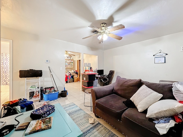 living room featuring light tile patterned floors and ceiling fan