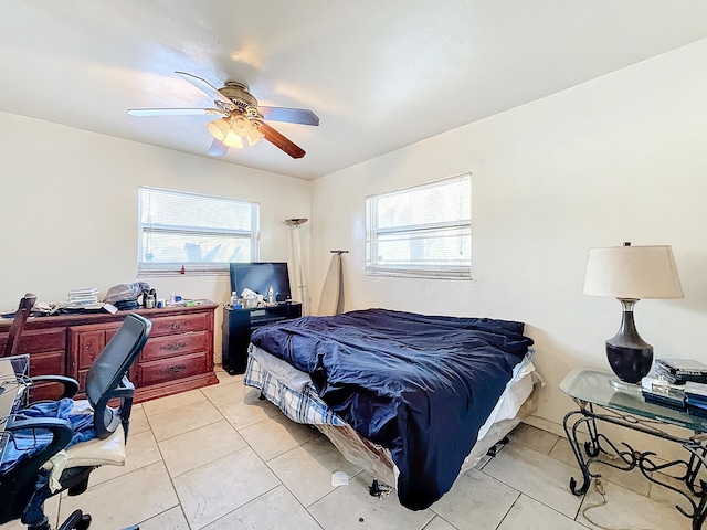 bedroom featuring light tile patterned floors and ceiling fan