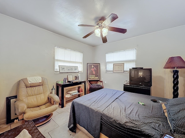 bedroom featuring light tile patterned flooring and ceiling fan