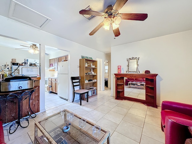 living room featuring ceiling fan and light tile patterned floors