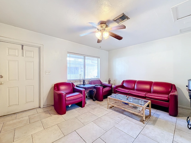 tiled living room with ceiling fan