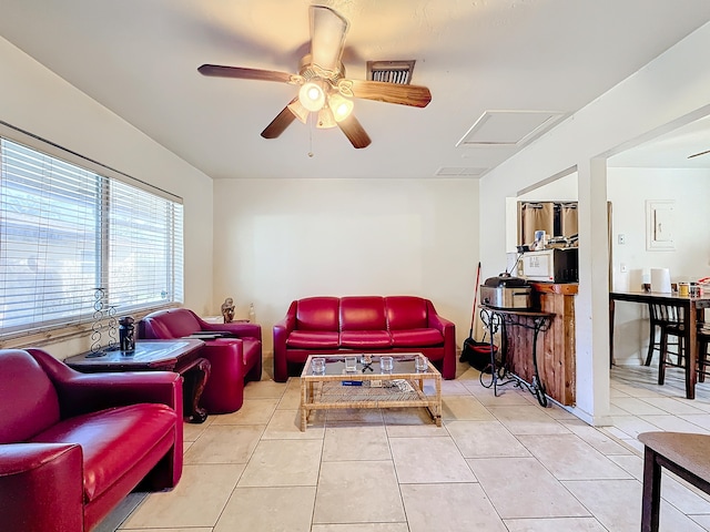 tiled living room featuring ceiling fan