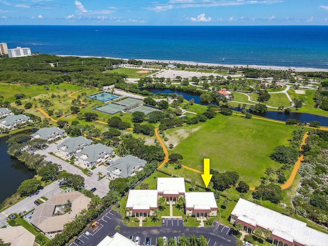 birds eye view of property featuring a water view