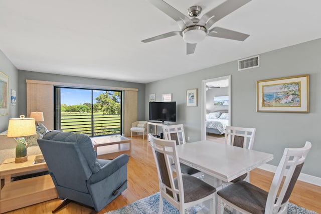 dining area featuring light hardwood / wood-style flooring and ceiling fan