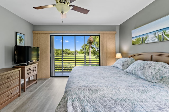 bedroom with light hardwood / wood-style floors, access to exterior, and ceiling fan