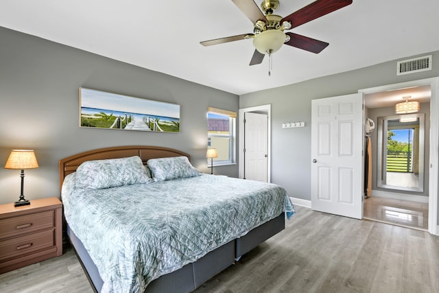 bedroom featuring ceiling fan and light hardwood / wood-style floors