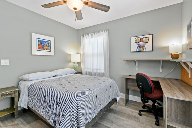 bedroom featuring hardwood / wood-style floors and ceiling fan