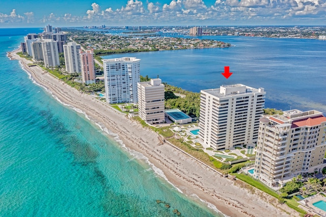 bird's eye view featuring a water view and a view of the beach