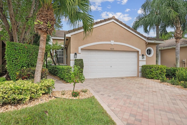 view of front of property with a garage