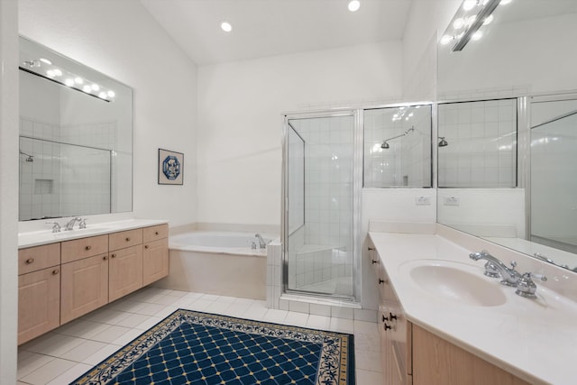 bathroom with tile patterned floors, separate shower and tub, and vanity