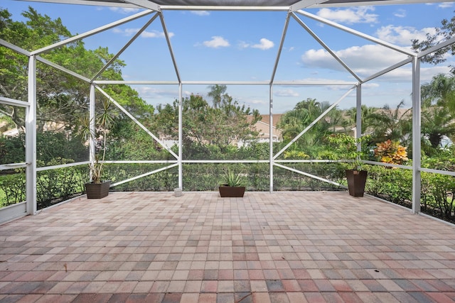 view of patio / terrace featuring a lanai