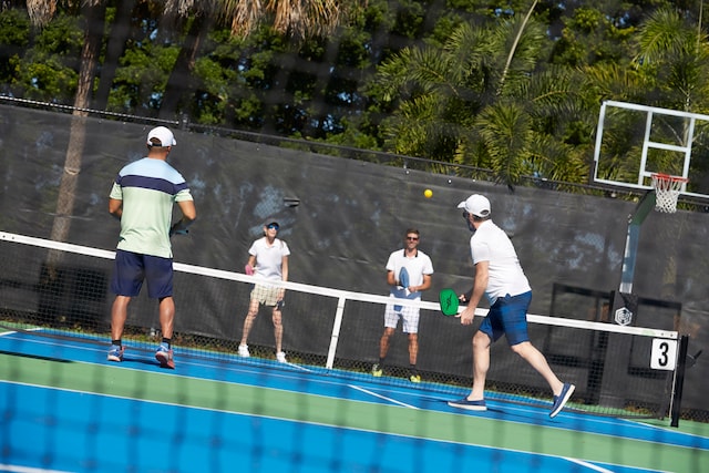 view of basketball court featuring tennis court