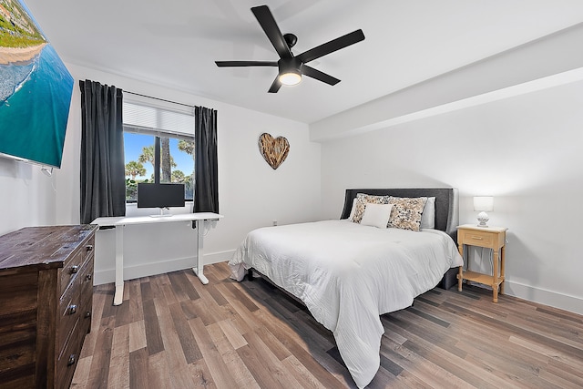 bedroom with hardwood / wood-style flooring and ceiling fan