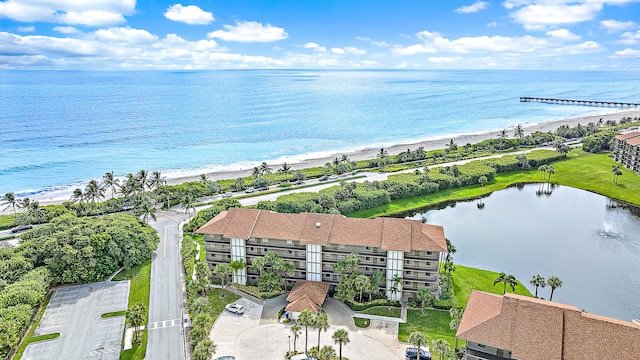 birds eye view of property featuring a view of the beach and a water view