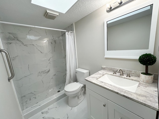 bathroom featuring vanity, toilet, and curtained shower