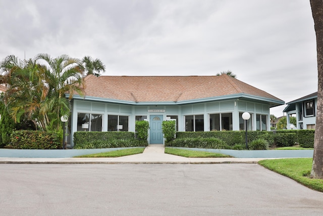 view of front of property with a sunroom