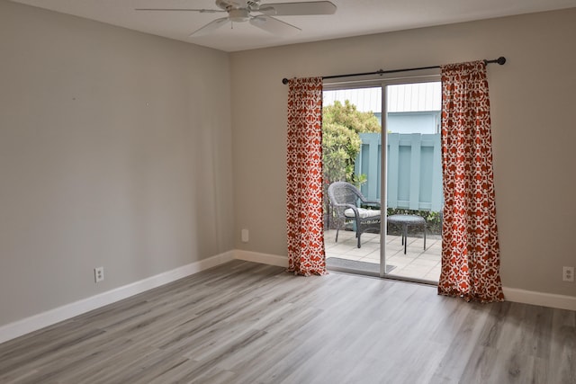 unfurnished room with light hardwood / wood-style floors and ceiling fan