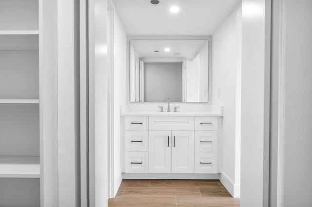 bathroom featuring vanity and hardwood / wood-style floors