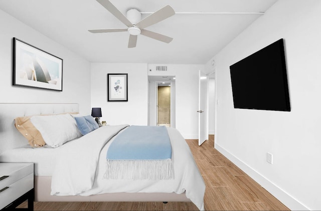 bedroom featuring ceiling fan and light wood-type flooring