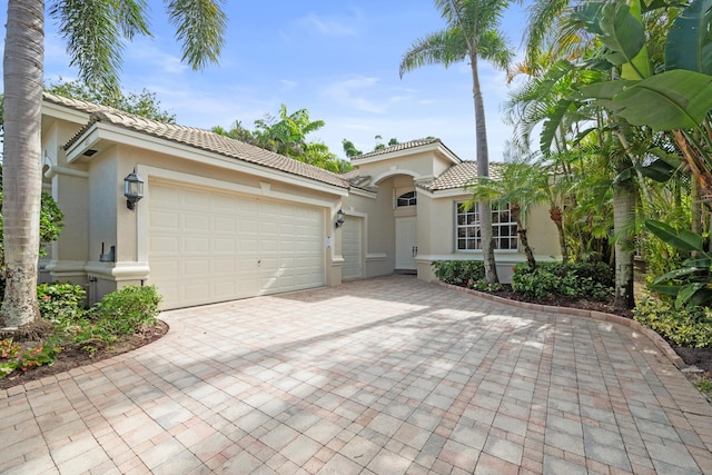 mediterranean / spanish-style house featuring a garage