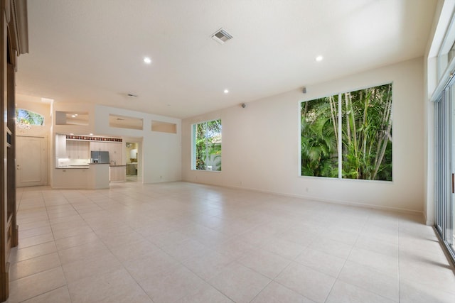 unfurnished living room featuring light tile patterned flooring