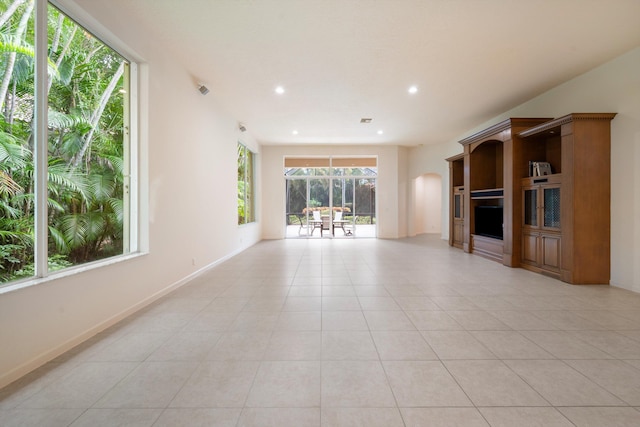 unfurnished living room with light tile patterned floors