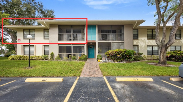 view of property with uncovered parking