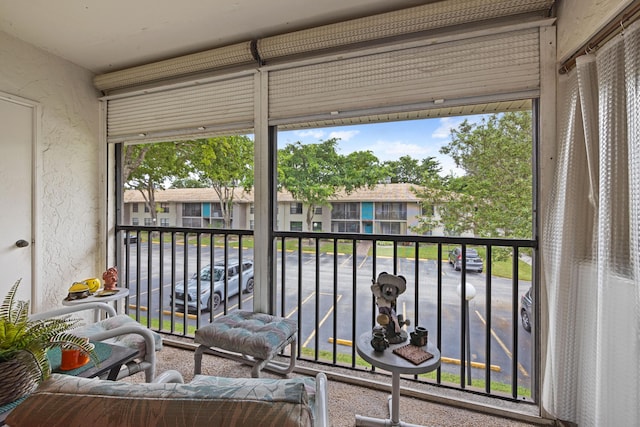 9780 Pineapple Tree Dr Unit 201, Boynton Beach, FL 33436 - sunroom / solarium featuring a residential view