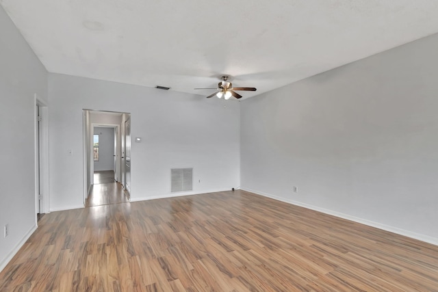 empty room featuring light hardwood / wood-style flooring and ceiling fan