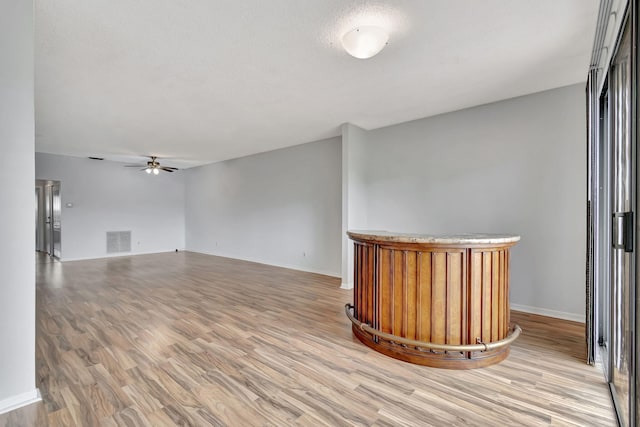 interior space with light hardwood / wood-style flooring and ceiling fan