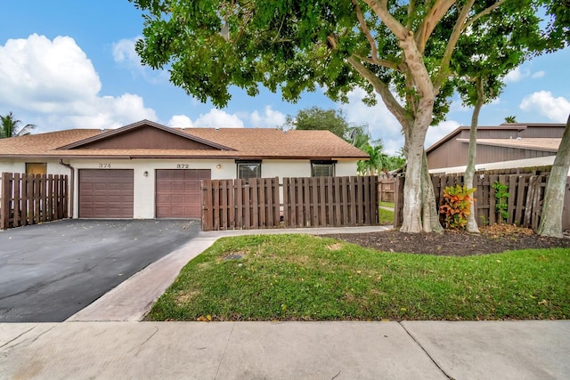 ranch-style house featuring a garage