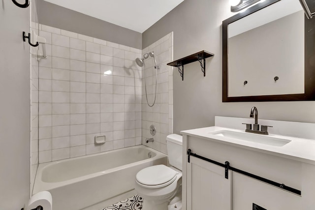 full bathroom with vanity, tiled shower / bath combo, toilet, and tile patterned floors