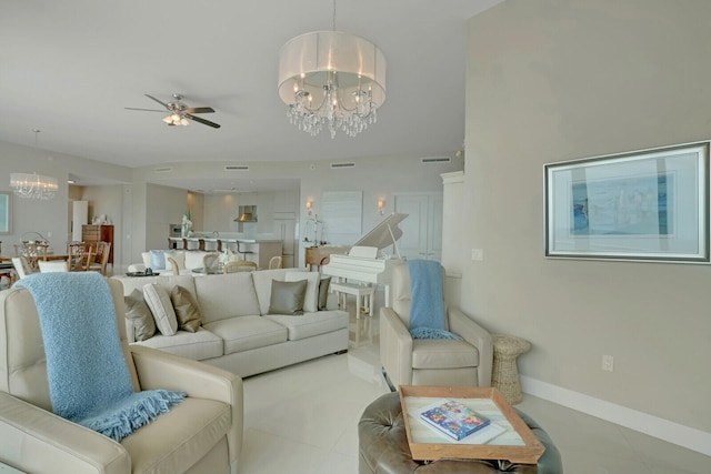 living room with ceiling fan with notable chandelier